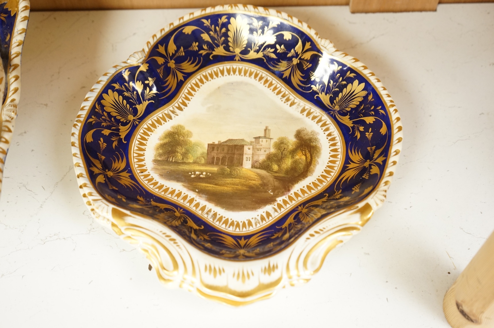 A Bloor Derby titled view part dessert service, c.1820 to include View on the Wye and View in Yorkshire, largest 29cm wide (16)